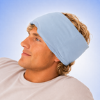 Man wearing a light blue headband against a clear blue sky
