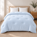 Baby Blue CloudSoft double-stuffed comforter on a made bed