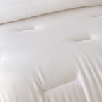 Close-up of a white mattress with a soft texture