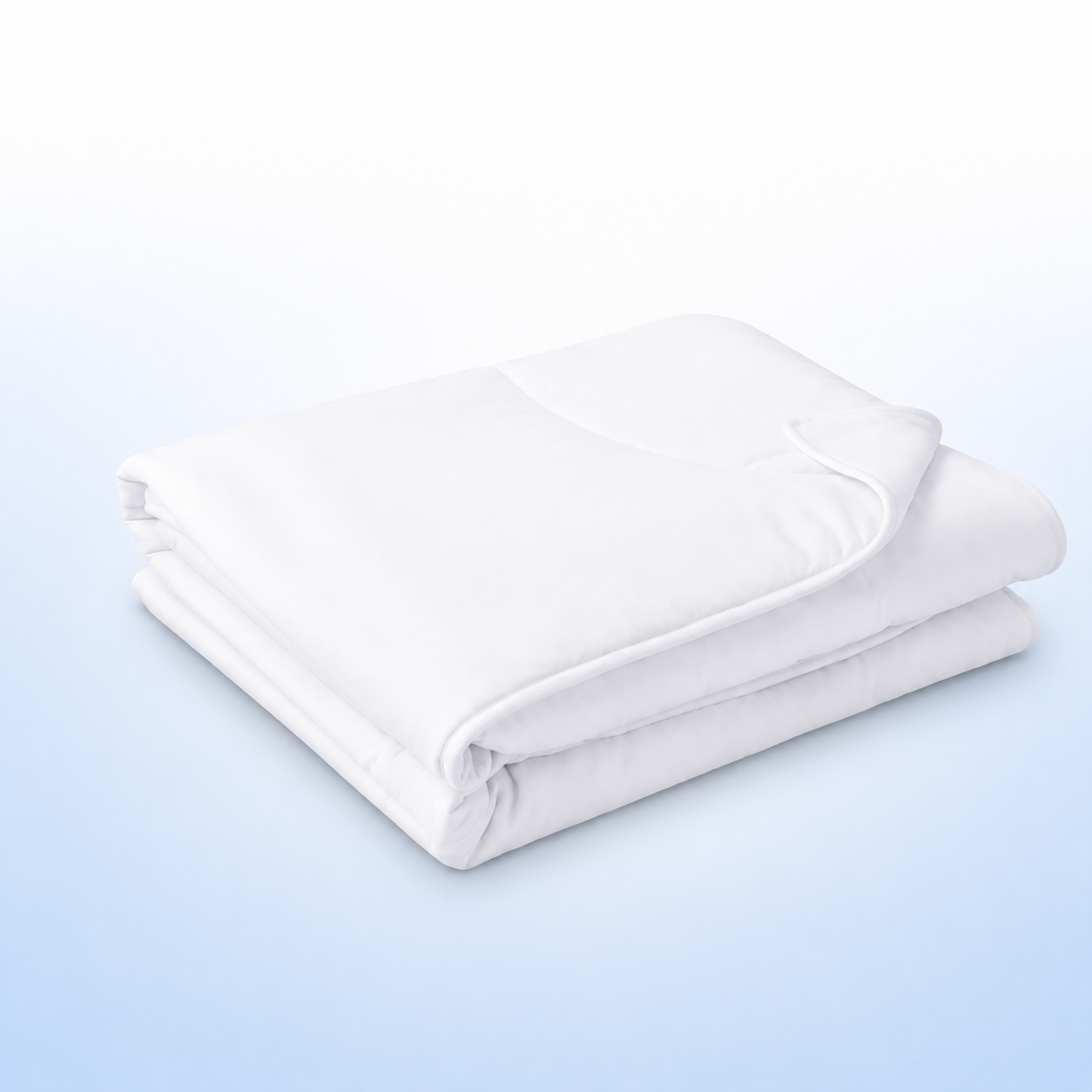 A folded white quilted comforter set, shown on a clean light blue and white gradient background.
