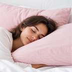 Woman sleeping peacefully with pink pillows and white bedding