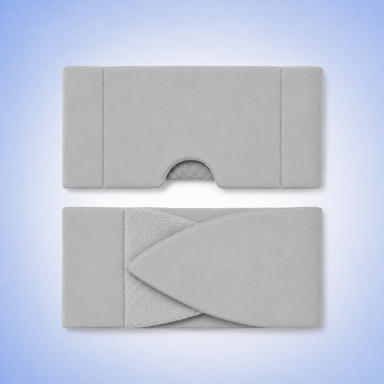 Front and back of eyemask in grey in a blue studio. 